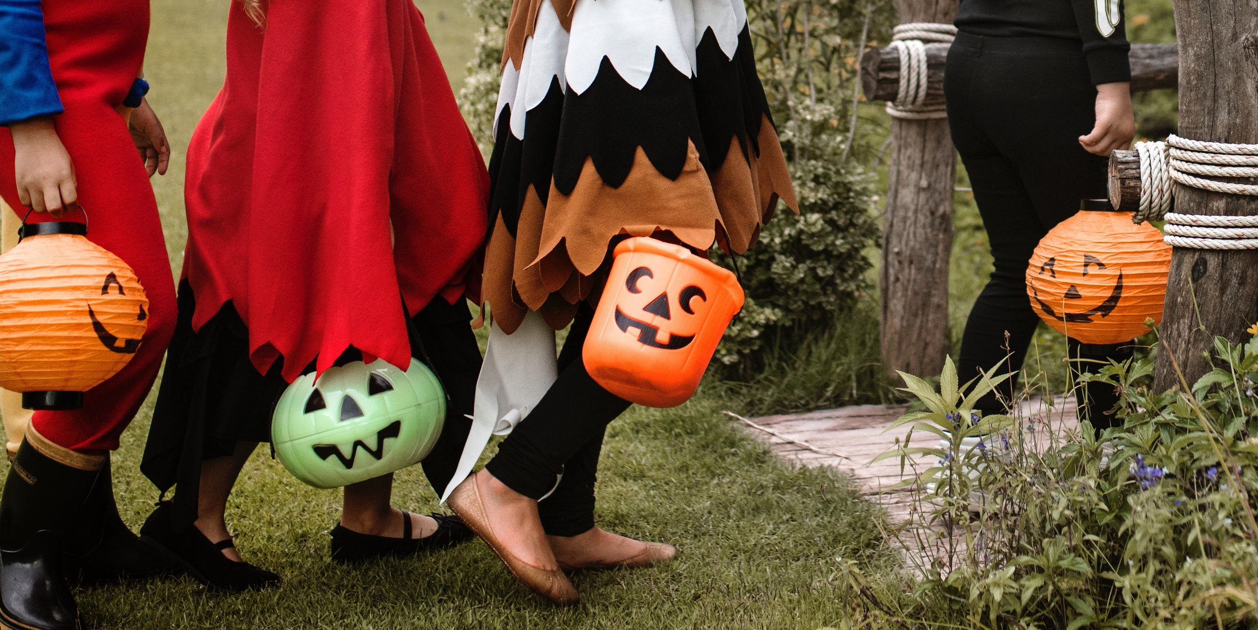 trick or treaters with pumpkins by rawpixel.jpg